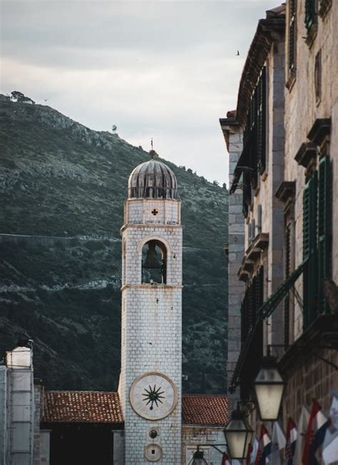 A clock tower in the middle of a city · Free Stock Photo