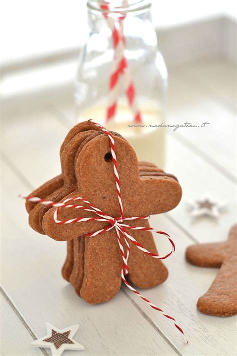 Gingerbread Cutouts Are Tied With Twine And Placed Next To A Glass Of Milk