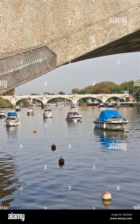 Richmond Look Footbridge And View Along River Thames Through Arch Of