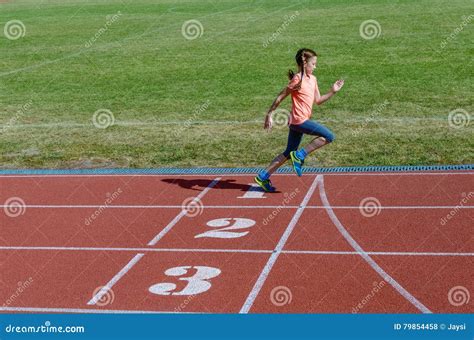 Kids Sport Child Running On Stadium Track Training And Fitness Stock