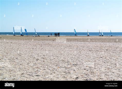 People Sailing On Land Yachts On Beach At North Sea Coast In Ijmuiden