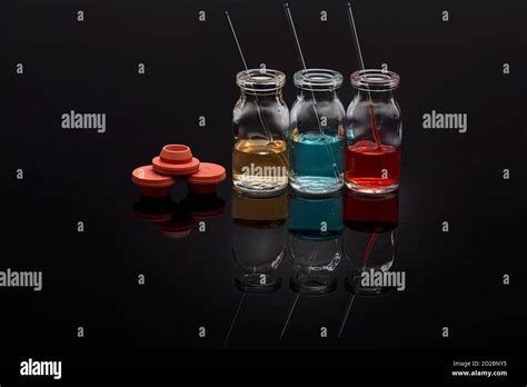 Glass Vials With Colored Medicine Liquid With Capillaries Red Yellow