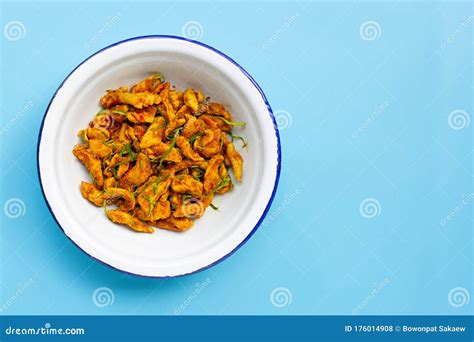 Chicken With Yellow Curry Paste On Blue Background Spicy Thai Food