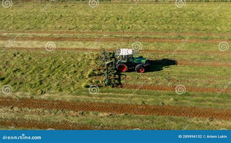 Harvesting And Drying Hay The Grass Tedder Turns Freshly Cut Grass