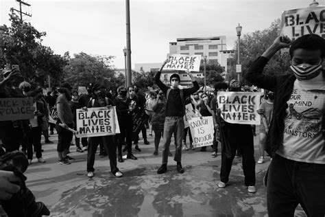 group  people holding  signs   street photo  usa image
