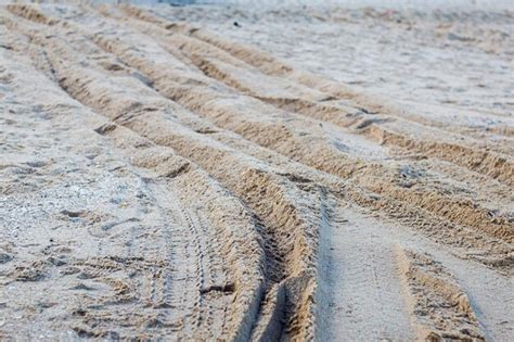 Premium Photo High Angle View Of Tire Tracks On Sand