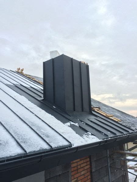 Metal Standing Seam Pitched Roof Extension With Roof Lights And Dormer