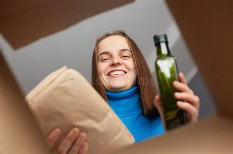 Smiling Kind Charming Woman Looking Inside Box Volunteer Collecting