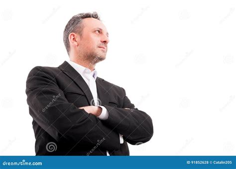 Confident Man In Formalwear Keeping His Arms Crossed Stock Photo