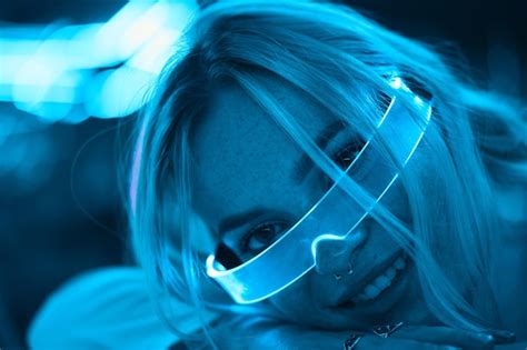 Premium Photo | Young woman in neon glasses cyberpunk style