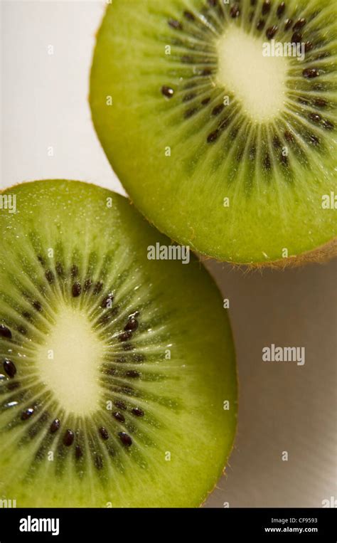 A Kiwi Cut In Half On A White Background Stock Photo Alamy