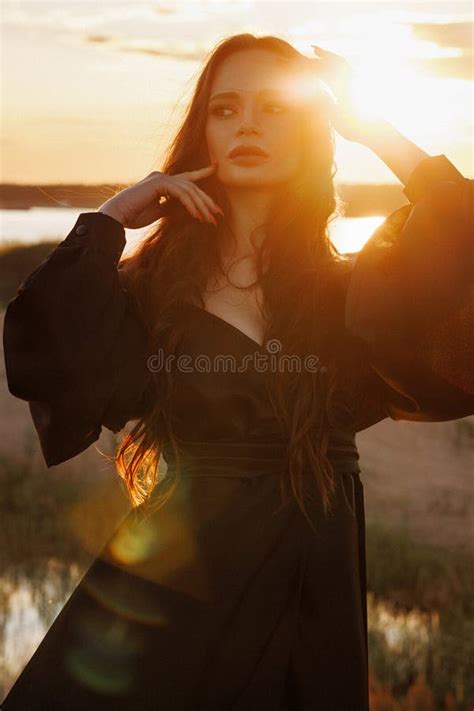 Portrait Of A Beautiful Brunette Woman With Long Hair Dress At Sunset Stock Image Image Of