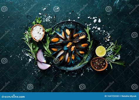 Mussels With Spices And Rosemary Seafood On Black Background Stock