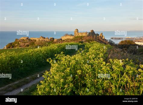 Hastings Castle Ruins at sunrise on Castle Hill cliff top overlooking the English Channel, East ...