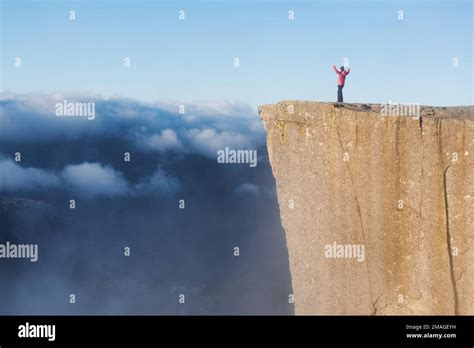 Preikestolen Amazing Rock In Norway Girl Standing On A Cliff Above