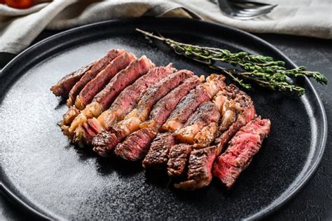 Grilled Sliced Steak Rib Eye With Pepper Black Background Stock Image