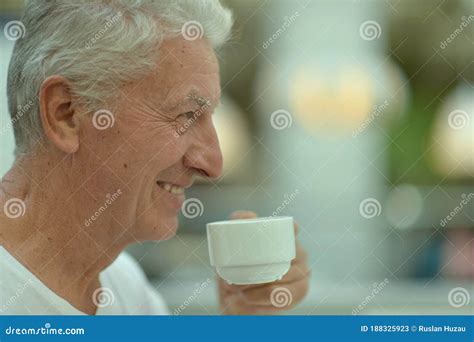 Portrait Of Smiling Senior Man Drinking Coffee Stock Image Image Of