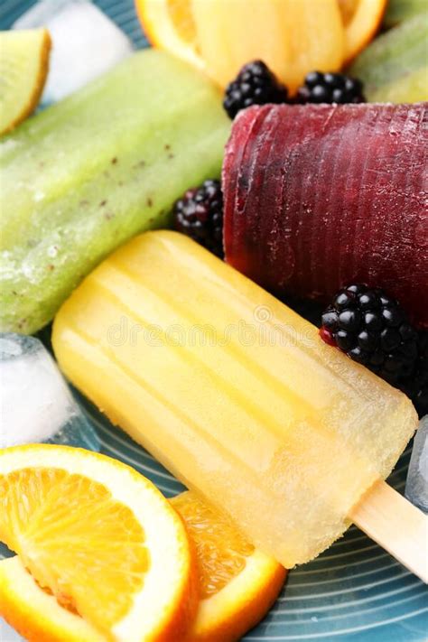 Delicious Popsicle Ice Cubes And Fresh Fruits On Plate Closeup Stock