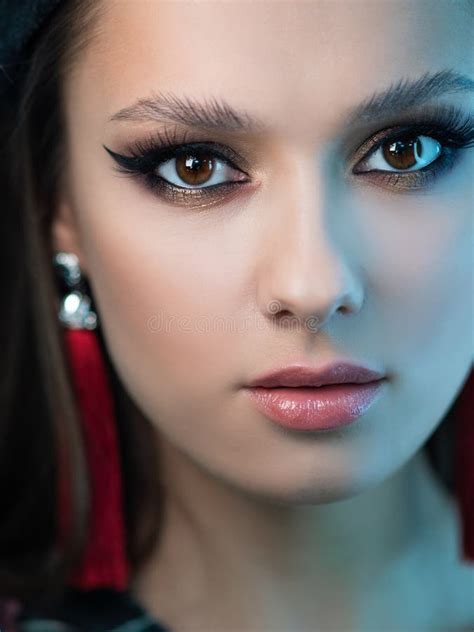 Bright Makeup And Red Tassel Earrings Portrait Of A Brunette Girl Stock Photo Image Of Makeup