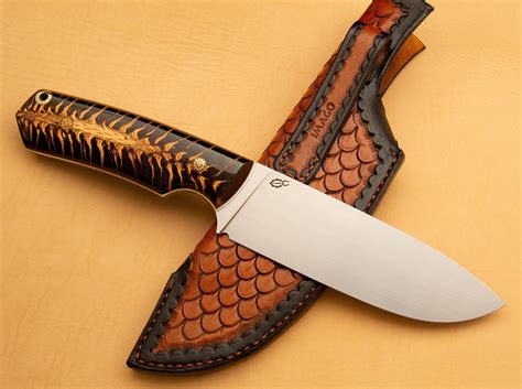 Made another bushcraft knife with spruce cone handle and custom sheath ...