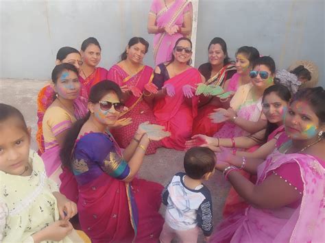 Greeting Each Other On The Festival Of Colors By Applying Gulal Women Played Holi With Flowers