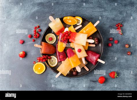 Fruits And Different Homemade Ice Lollies Made Of Fruit Juice And Pulp