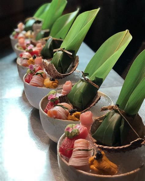 Small Bowls Filled With Food On Top Of A Table