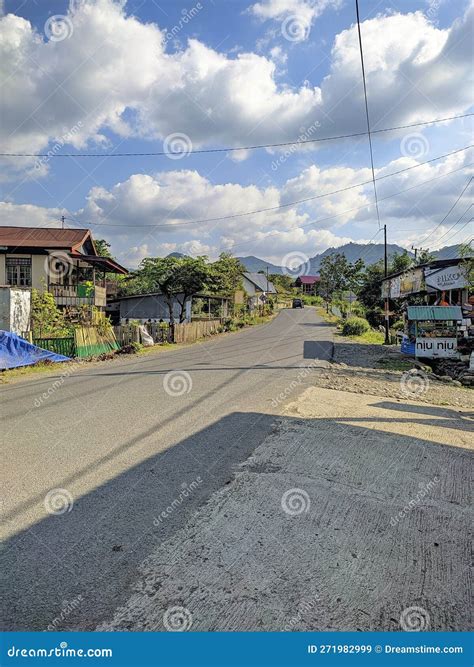 Country Road with a Few Buildings is on the Outskirts Editorial Stock