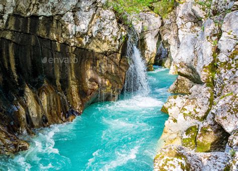 Beautiful Turquoise Stream And Waterfalll In Gorge Soca River Bovec