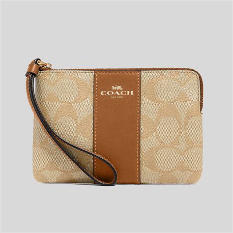 Coach Corner Zip Wristlet In Signature Canvas Light Khakisaddle 58035