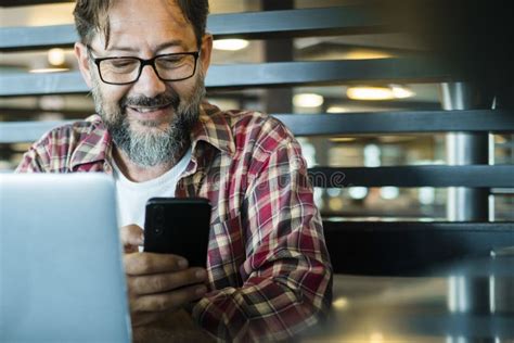 Happy Modern Mature Man At Work In Coworking Workplace Alternative