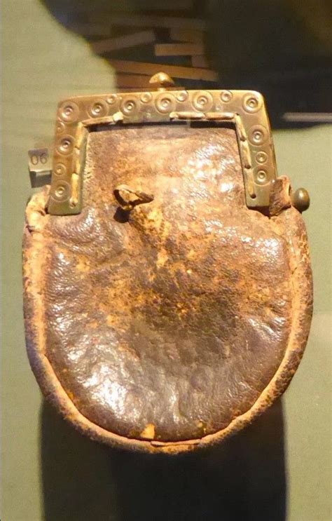 An Old Metal Object Sitting On Top Of A Table