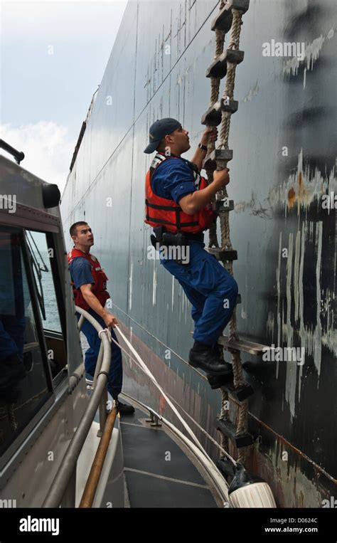 Us Coast Guard Agents Climb Rope Ladder To Board A Tanker Ship Port