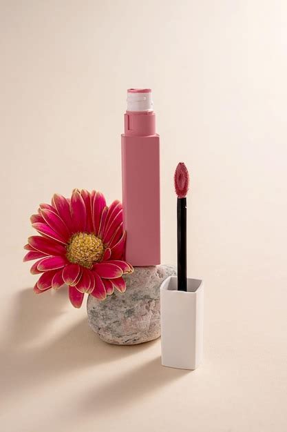 Premium Photo Pink Liquid Lipstick And Applicator Brush With Flowers