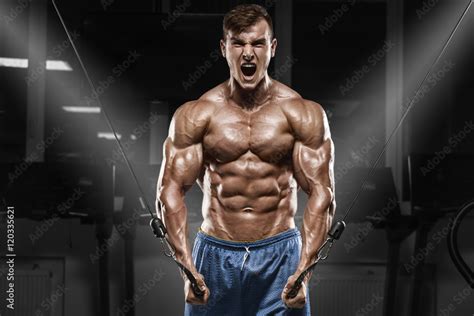 Muscular Man Working Out In Gym Doing Exercises Strong Male Naked Torso Abs Stock Photo Adobe