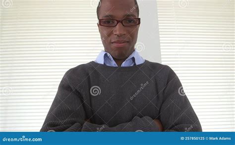 Confident African American Business Man Crossing Arms In Office Stock