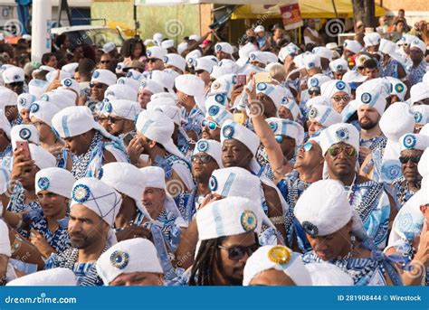 Group Of People Marching In A Parade At The Filhos De Gandhy Festival