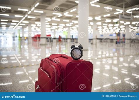 Time To Travel Or Travel Delay Concept Black Alarm Clock On Red