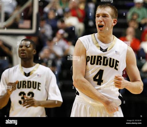 Purdue University Forward Robbie Hummel R Reacts Near Purdue Guard E