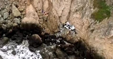 4 rescued after Tesla plunges off cliff in California - CBS News