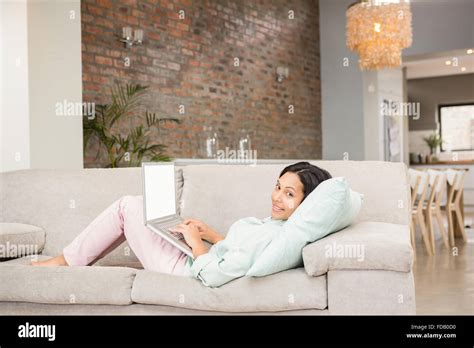 Smiling Brunette Using Laptop Stock Photo Alamy
