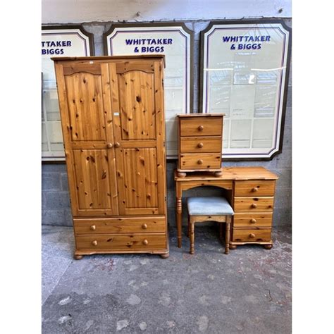 A Pine Three Piece Bedroom Suite Comprising Double Wardrobe Bedside