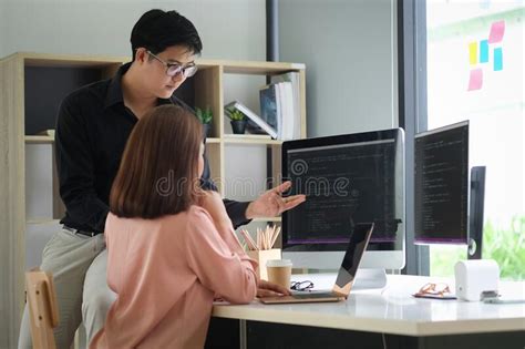 Side View Of Female Programmer Working With Computer At Modern Office