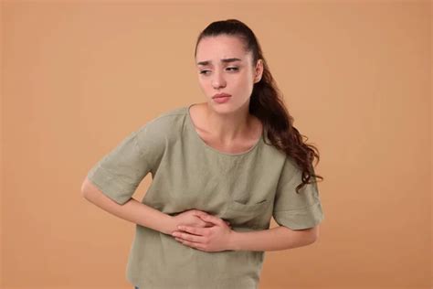 Woman Suffering Abdominal Pain Beige Background Space Text Unhealthy