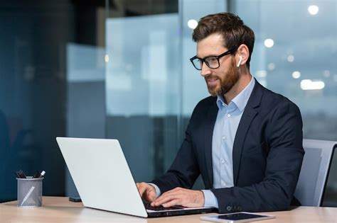 Premium Photo Successful Mature Businessman At Work With Laptop