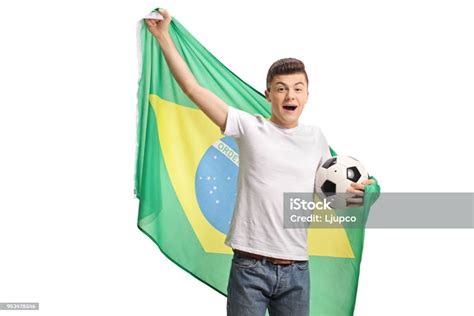 Joyful Teenage Soccer Fan Holding A Football And A Brazilian Flag Stock