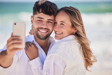 Beach Love And Happy Couple Taking A Selfie While On A Date For