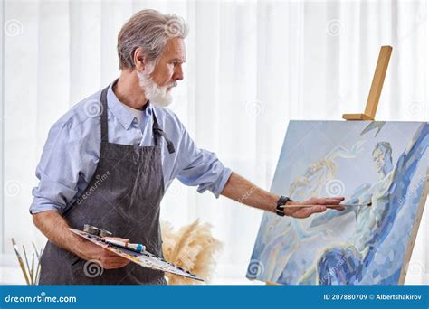 Mature Artist Painting On Easel Canvas Stock Image Image Of