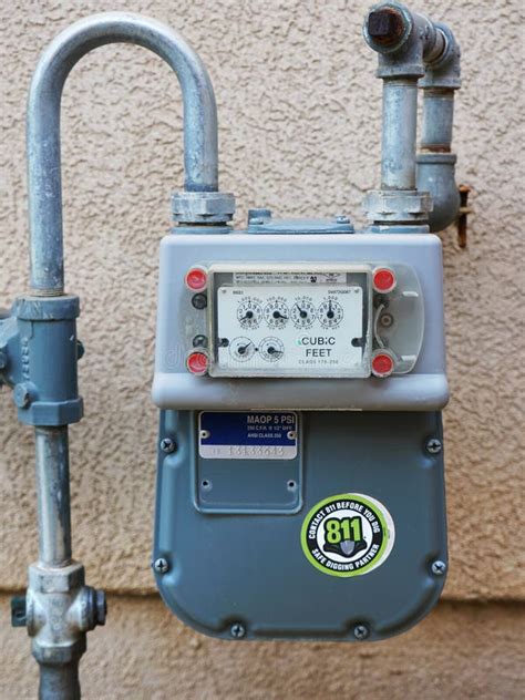 Residential Natural Gas Meter On The Side Of A House Stock Image