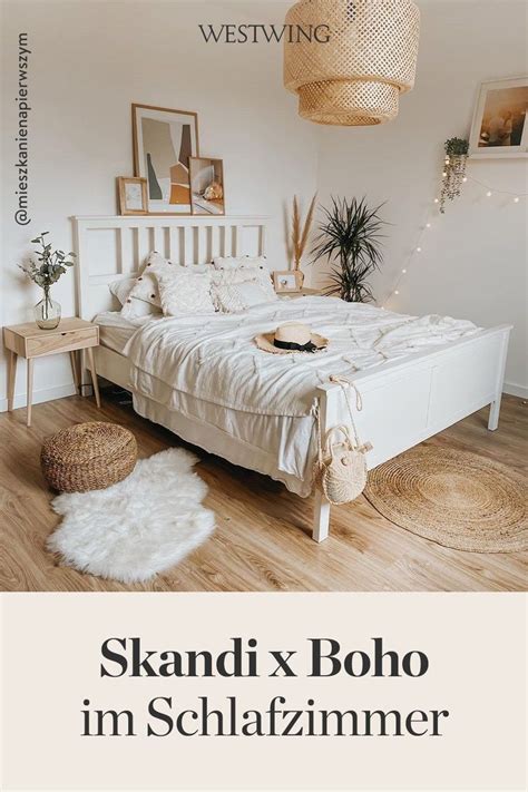 A White Bed Sitting In A Bedroom Next To A Wooden Floor